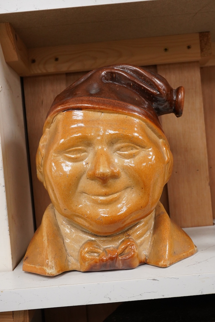 A large 19th century Johnny Souter, salt glazed stoneware spirit flask impressed T A Moss wine and spirit Merchant Bell Mount street Grosvenor square, 28cm high